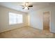 Spacious bedroom with ceiling fan and walk-in closet at 6340 Revolutionary Trl, Charlotte, NC 28217