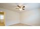 Simple bedroom with ceiling fan and access to hallway at 6340 Revolutionary Trl, Charlotte, NC 28217