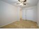 Well-lit bedroom with double door closet and ceiling fan at 6340 Revolutionary Trl, Charlotte, NC 28217