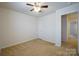 Spacious bedroom with ceiling fan and neutral carpeting at 6340 Revolutionary Trl, Charlotte, NC 28217