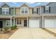 Two-story townhome with attached garage and neutral color scheme at 6340 Revolutionary Trl, Charlotte, NC 28217