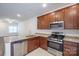 Modern kitchen with granite countertops and stainless steel appliances at 6340 Revolutionary Trl, Charlotte, NC 28217