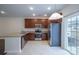 Modern kitchen with granite countertops and stainless steel appliances at 6340 Revolutionary Trl, Charlotte, NC 28217