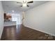 Spacious living room with hardwood floors and kitchen view at 6340 Revolutionary Trl, Charlotte, NC 28217