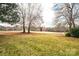 Landscaped backyard with a view of a golf course at 641 20Th Avenue Nw Dr, Hickory, NC 28601