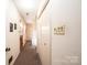 Long hallway with light walls, carpet flooring, and access to other rooms at 641 20Th Avenue Nw Dr, Hickory, NC 28601