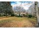 Back of house with hedges and a grassy yard at 641 20Th Avenue Nw Dr, Hickory, NC 28601