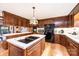 Eat-in kitchen with island, stainless steel appliances, and wood cabinets at 641 20Th Avenue Nw Dr, Hickory, NC 28601