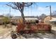 Large backyard with a deck and a tree at 6534 Monteith Dr, Charlotte, NC 28213