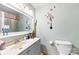 Clean bathroom with a single sink vanity and shower/tub combo at 6534 Monteith Dr, Charlotte, NC 28213