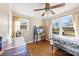 Bedroom with hardwood floors, ceiling fan, and two large windows at 6534 Monteith Dr, Charlotte, NC 28213