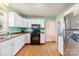 Kitchen with stainless steel appliances and wood floors at 6534 Monteith Dr, Charlotte, NC 28213