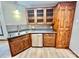 Corner kitchen sink, wood cabinets, and stainless steel dishwasher at 69 Saint Charles Ct, Hickory, NC 28601