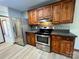 Kitchen boasts stainless steel appliances and wood cabinets at 69 Saint Charles Ct, Hickory, NC 28601