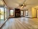 Living room with fireplace, wood-look floors, and large windows at 69 Saint Charles Ct, Hickory, NC 28601