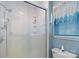 Clean bathroom showcases glass door shower, white tile and updated fixtures at 709 Falls Church Rd, Charlotte, NC 28270