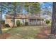 Charming single-story home features light blue shutters, a cozy front porch, and a well-manicured lawn at 709 Falls Church Rd, Charlotte, NC 28270