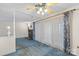 Living room showcases a fireplace, blue carpeting, and light-filled sliding doors at 709 Falls Church Rd, Charlotte, NC 28270