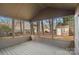 Large screened porch provides views to the backyard, and shade from the trees at 709 Falls Church Rd, Charlotte, NC 28270