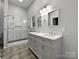 Bathroom with double vanity and a large walk-in shower at 7129 Spandril Ln, Charlotte, NC 28215