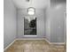 Simple dining area with tile floor and large window at 7129 Spandril Ln, Charlotte, NC 28215