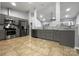 Modern kitchen with gray cabinets and stainless steel appliances at 7129 Spandril Ln, Charlotte, NC 28215