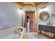 Bathroom with a garden tub, vanity, and view of the Primary bedroom at 7404 Mockingbird Ln # 73, Waxhaw, NC 28173