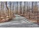 Long gravel driveway leading to a wooded property at 7404 Mockingbird Ln # 73, Waxhaw, NC 28173