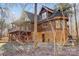 Log home showcasing a side view with deck and landscaping at 7404 Mockingbird Ln # 73, Waxhaw, NC 28173