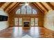 Spacious living area with vaulted ceiling, fireplace, and hardwood floors at 7404 Mockingbird Ln # 73, Waxhaw, NC 28173