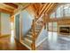 Wooden staircase with a rustic feel and access to upper level at 7404 Mockingbird Ln # 73, Waxhaw, NC 28173