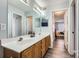 Double vanity bathroom with view of another bedroom at 7871 Petrea Ln, Charlotte, NC 28227