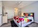 Bedroom with colorful bedding and ceiling fan at 7871 Petrea Ln, Charlotte, NC 28227