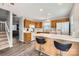 Kitchen with island, wood cabinets, and white appliances at 7871 Petrea Ln, Charlotte, NC 28227