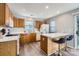 Modern kitchen featuring wood cabinets and an island at 7871 Petrea Ln, Charlotte, NC 28227