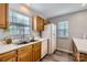 Clean kitchen with wood cabinets and white countertops at 7871 Petrea Ln, Charlotte, NC 28227