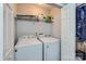 Laundry room with washer, dryer, and shelving for storage at 7871 Petrea Ln, Charlotte, NC 28227