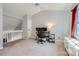 Spacious loft area with vaulted ceiling and window at 7871 Petrea Ln, Charlotte, NC 28227