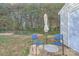 Small patio with table and chairs, offering a relaxing outdoor space at 7871 Petrea Ln, Charlotte, NC 28227