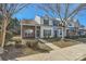 Front view of three brick townhouses at 7871 Petrea Ln, Charlotte, NC 28227