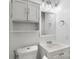 Simple bathroom with white vanity and storage cabinet at 809 Hasty Rd, Marshville, NC 28103