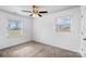 Well-lit bedroom featuring ceiling fan and window blinds at 809 Hasty Rd, Marshville, NC 28103