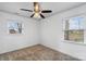 Bright bedroom with ceiling fan, new carpet, and two windows at 809 Hasty Rd, Marshville, NC 28103