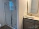 Modern bathroom with a glass shower and gray vanity at 813 Gondola Ct # 107, Salisbury, NC 28144