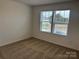 Bright bedroom with neutral carpeting and two large windows at 813 Gondola Ct # 107, Salisbury, NC 28144