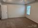 Spacious bedroom with neutral carpeting and a window at 813 Gondola Ct # 107, Salisbury, NC 28144