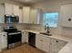 Modern kitchen with stainless steel appliances and white cabinets at 813 Gondola Ct # 107, Salisbury, NC 28144