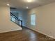 Bright living room featuring hardwood floors and a staircase at 813 Gondola Ct # 107, Salisbury, NC 28144