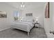 Well-lit main bedroom with neutral décor, a ceiling fan, and plush carpeting at 8138 Annsborough Nw Dr, Concord, NC 28027