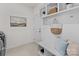 Functional mudroom with built-in shelving, seating, and storage space at 8138 Annsborough Nw Dr, Concord, NC 28027